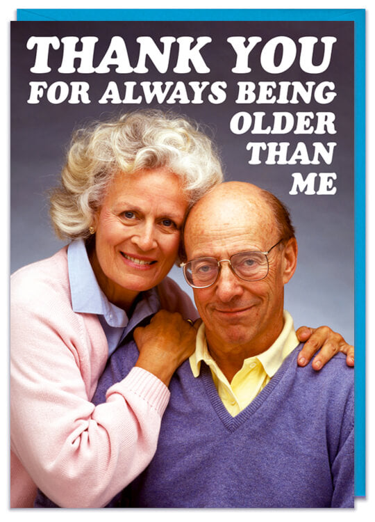 A greeting card with a sweet photo of an affection old couple smiling at the camera