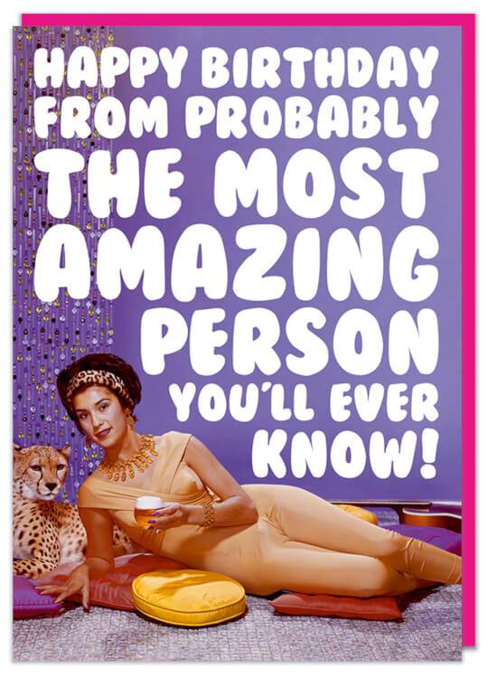 A birthday card featuring a picture of a sensational woman lying on the floor next to a leopard