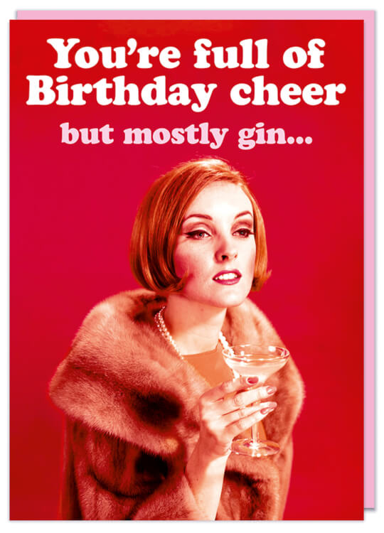 A birthday card with a 1960s picture of a classy looking woman in a fur coat holding a martini glass looking into the distance