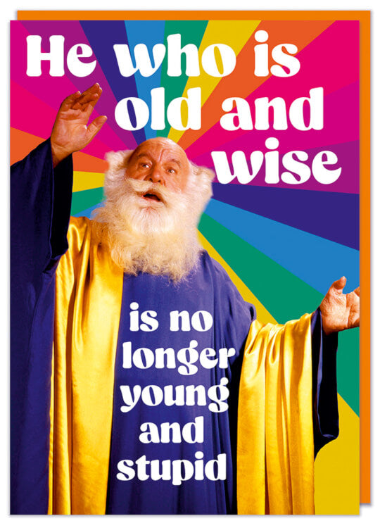 A funny birthday card with a retro picture of a wise old man in shaman robes looking wise infront of a rainbow starburst
