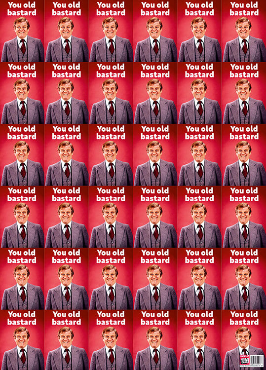 Bright red wrapping paper with a picture of a smiling man in a suit with the words ‘You old bastard’ above him in simple white font. This repeats across the entire paper