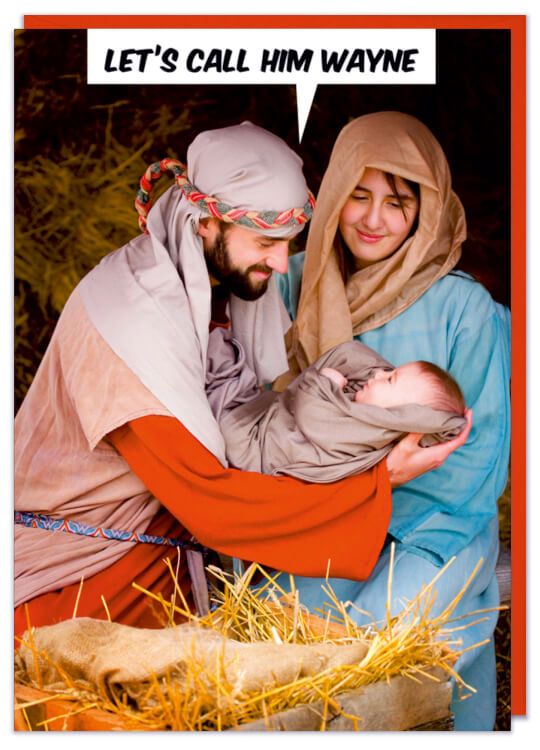A Christmas card with a staged photo of Jesus and Mary cradling baby Jesus in the stable