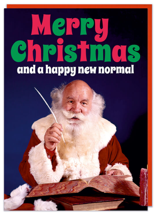 A Christmas Card with a picture of Santa Claus at his desk