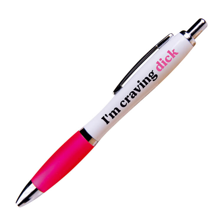 A white ballpoint pen with a pink grip and black ink. Black and pink text reads I'm craving dick