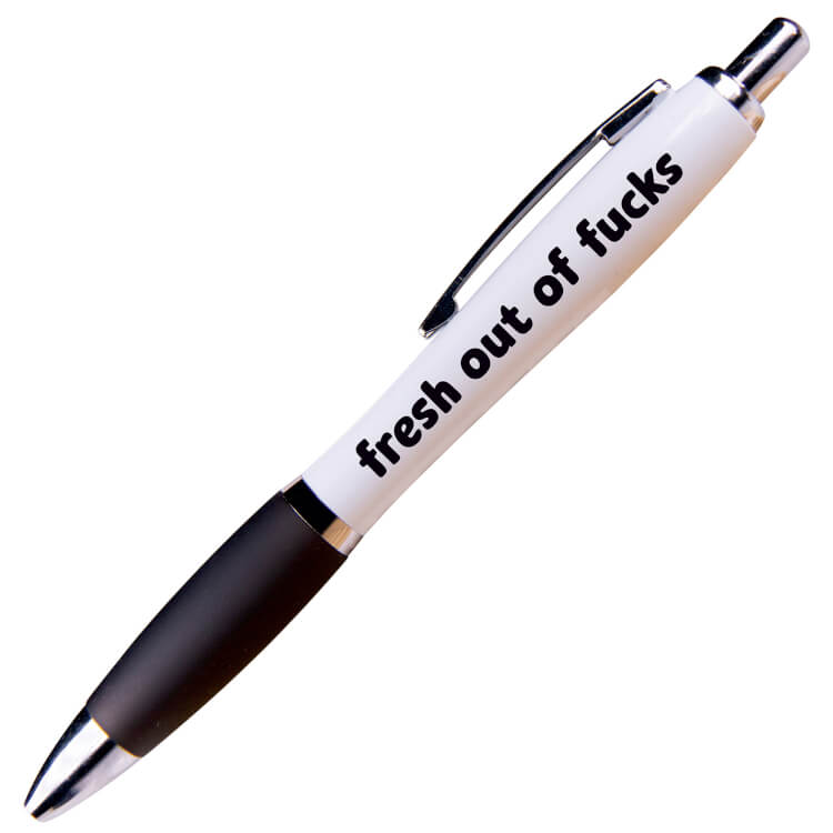 A white ballpoint pen with a black grip and black ink. Black rounded text reads Fresh out of fucks