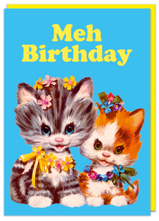 A funny birthday card with a cute whimsical illustration of two kittens against a blue background. Rounded yellow text above them reads Meh birthday
