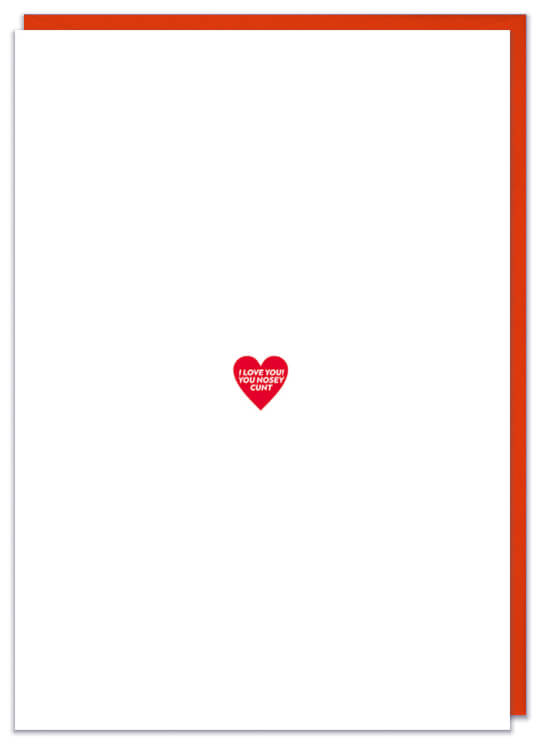 A white Valentines card with a small red hard in the middle. Inside this heart tiny text reads I love you! You nosey cunt