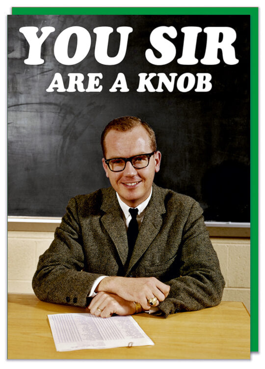 A greeting card with a 1960s picture of a smiling man sat at desk in front of blackboard