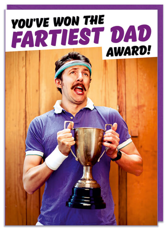 A Fathers Day card with a funny picture of a man holding a trophy