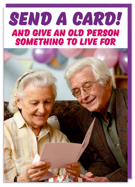 A funny birthday card with a photo of two old people opening up a greeting card