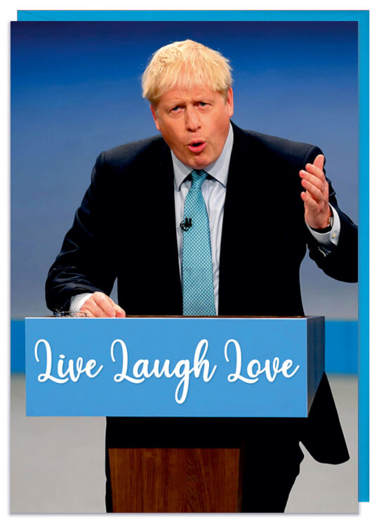 A birthday card with a picture of Boris Johnson standing at a conference lectern which reads live laugh love