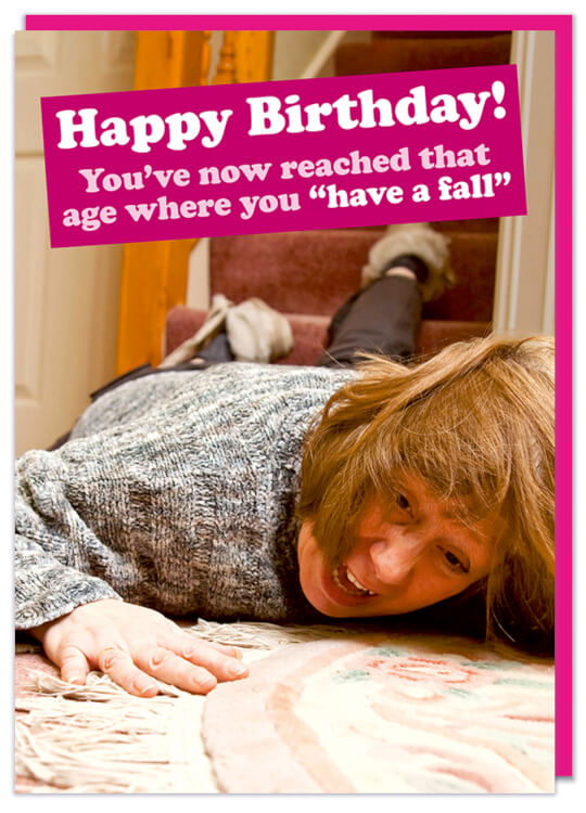 A birthday card with a picture of an elderly woman lying at the foot of a set of stairs