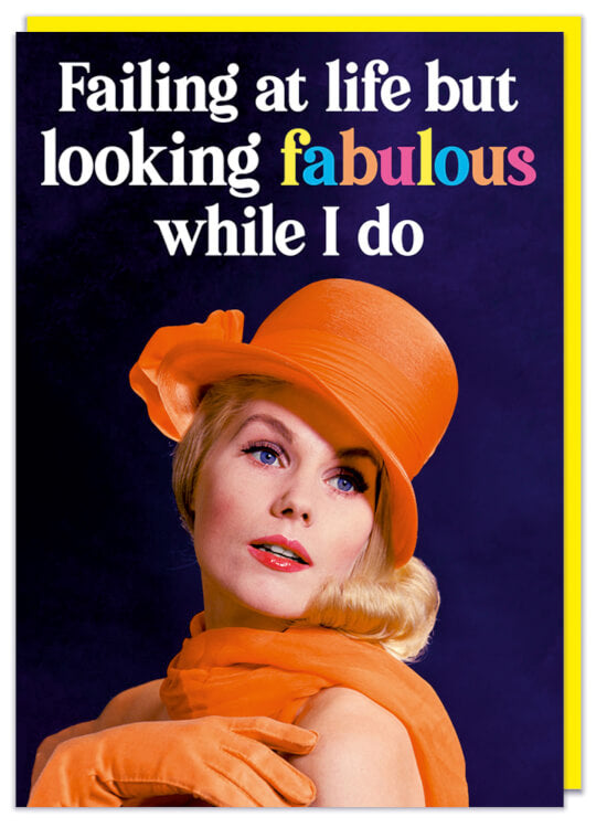 A birthday card with a 1960s glamorous young woman in an orange ensemble looking away.  Smart white and multicoloured text above her reads Failing at life but looking fabulous while I do