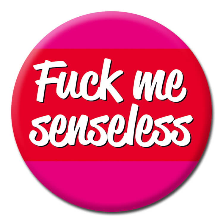 This dark pink badge has a deep red band across the middle in which are white lower case text that reads Fuck me senseless