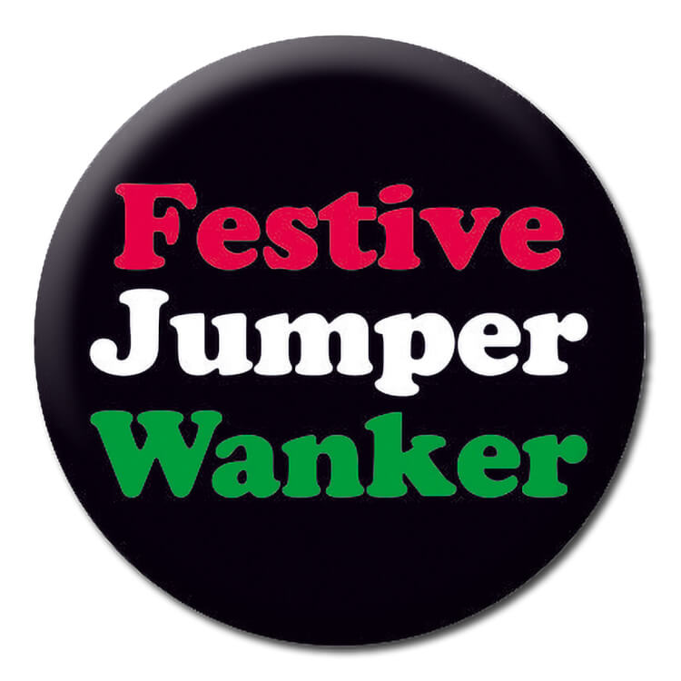 A black Christmas badge with white, red and green rounded text reading Festive jumper wanker