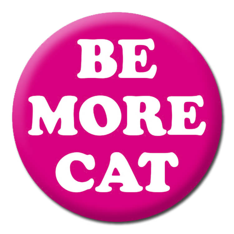 A bright pink badge with bold white rounded text that reads Be more cat.