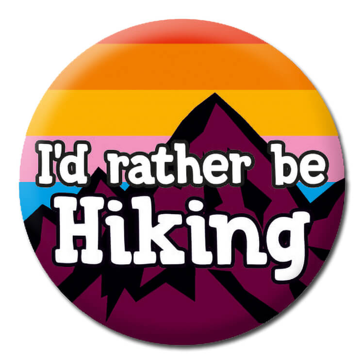 A badge with an illustration of a dark mountain against a sunset sky.  black outlined white text reads I'd rather be hiking