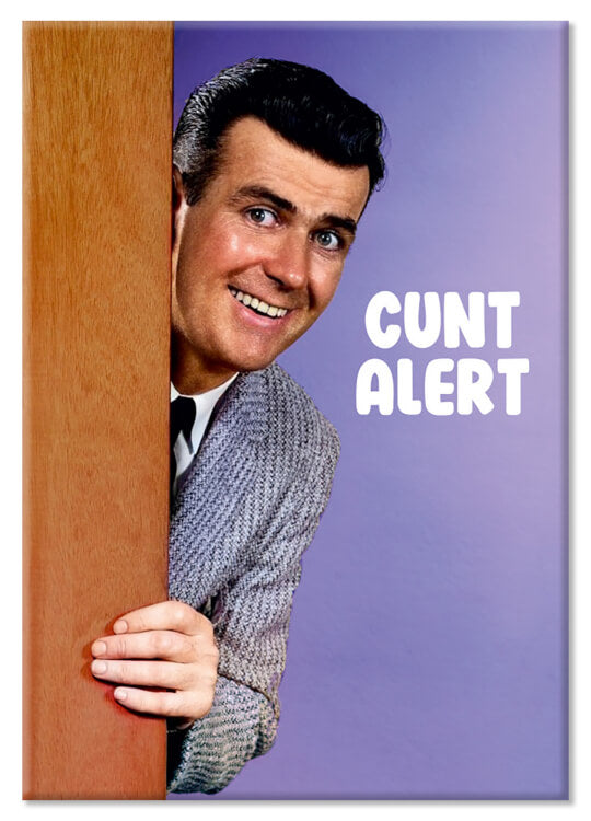 A fridge magnet with a retro picture of a smiling man peering around a wooden door and smiling to camera.  Bold white text beside him reads Cunt alert