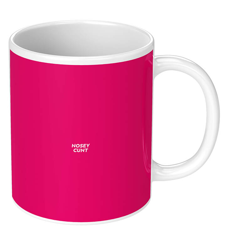 A deep pink novelty mug with very small capital letters in the middle reading nosey cunt