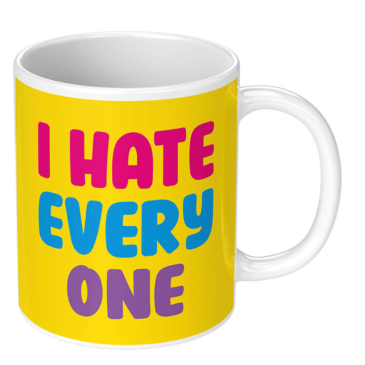 A bright yellow novelty mug with bold pink, blue and purple in the middle the reads i hate everyone