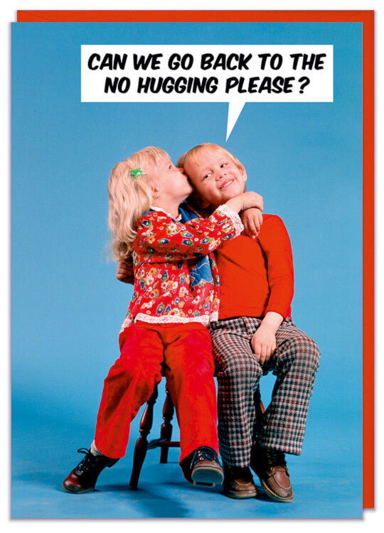 A birthday card with a 1960s photo of a young girl hugging and kissing a young boy