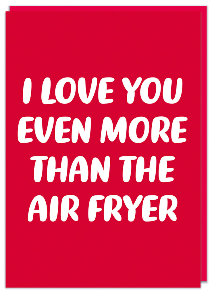 A deep red Valentine's day card with simple rounded white text that reads I love you even more than the air fryer