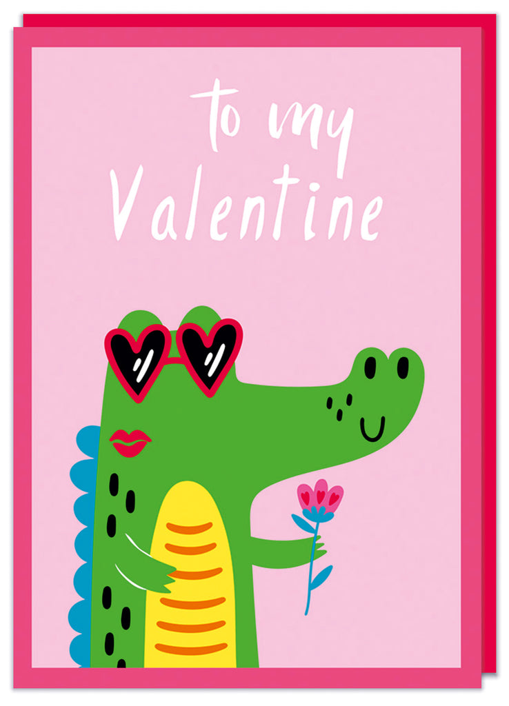 A cute Valentine's card with a deep red border and inside is an illustration of a cutecrocodile wearing heart shaped shades and holding a rose