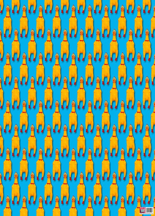 A bright blue wrapping paper with a repeated image of a face on rubber chicken across and down the paper