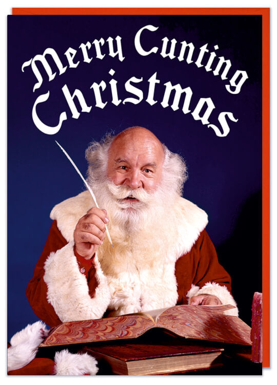 A Christmas card with a retro picture of Father Christmas sitting down writing with a quill pen