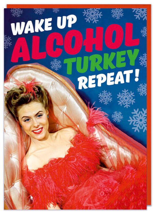 A Christmas card with a 1960s picture a young woman wearing a red nightie lying on a chaise lounge