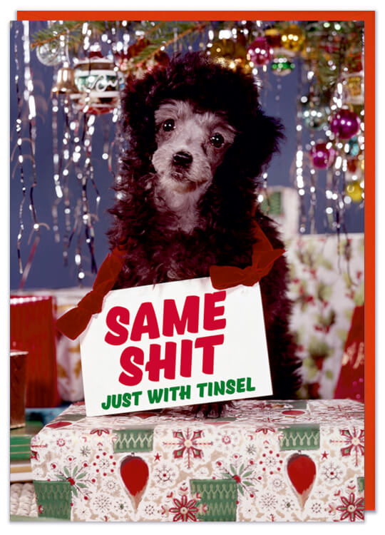 A Christmas card with a retro picture of a sad looking puppy in front of a 1960s Christmas tree