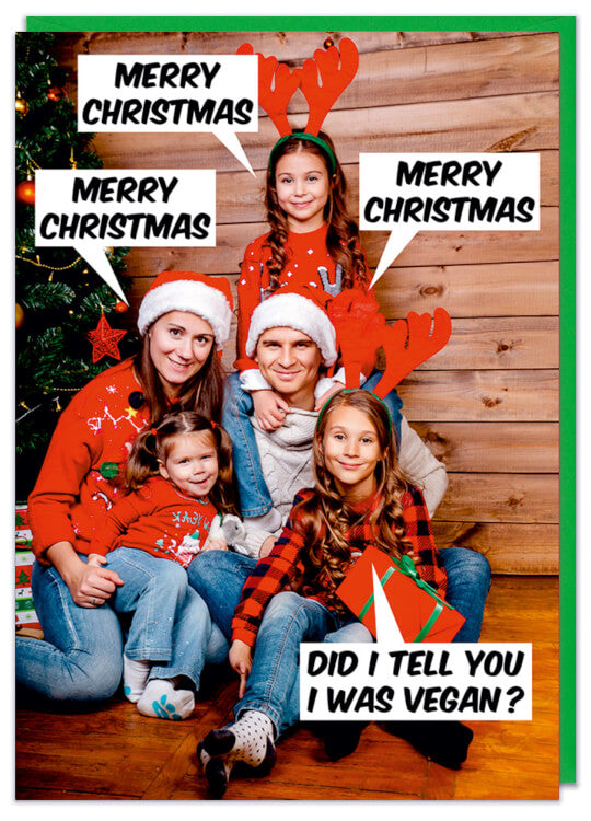 A Christmas card with a picture of a smiling family all in santa or antler hats