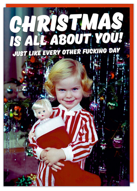 A Christmas card with a 1960s picture of a precocious young girl holding a doll