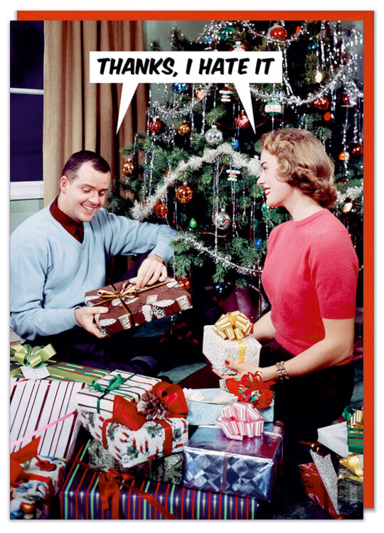 A Christmas Card with a picture of a couple opening presents
