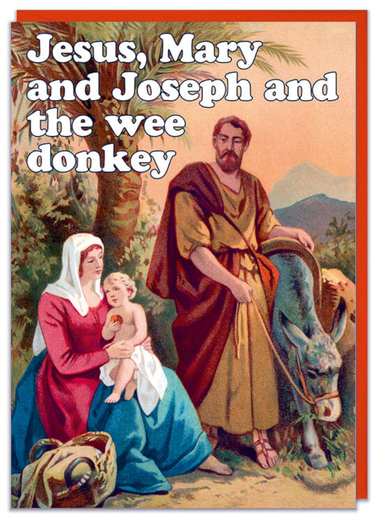A Christmas card with a painting of Jesus, Mary and Joseph riding into Bethlehem of a donkey