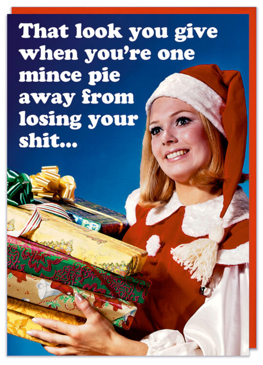A Christmas card with a retro picture of a smiling woman looking into the distance dressed as a festive elf
