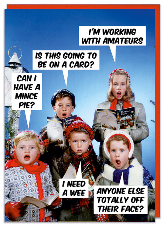 A Christmas card with a 1960s picture of five children carol singing