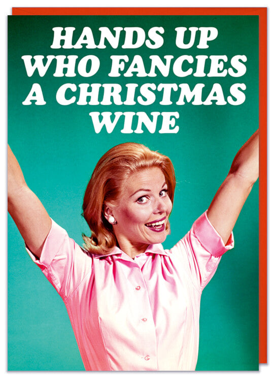 A Christmas card with a 1960s picture of a smiling woman in a pink blouse holding up both hands