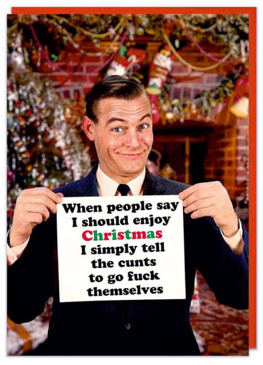A Christmas card featuring a retro picture of a smiling man holding a sing that reads When people say i should enjoy Christmas i simply tell the cunts to go fuck themselves
