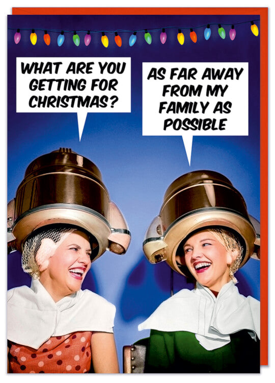 A Christmas card featuring a retro picture of two women laughing at each other under commercial hair dryers