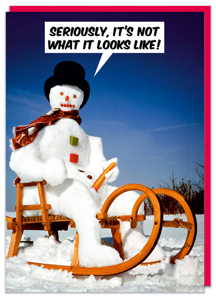 A funny Christmas card with a photo of a snowman sitting on a sledge holding a carrot sticking out of his crotch