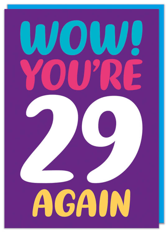 A bold purple birthday card with blue, red, yellow and white rounded letters that read Wow! You're 29 again
