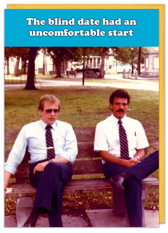 A birthday card with a retro style colour photo of two men sat awkwardly on a bench wearing very similar clothing