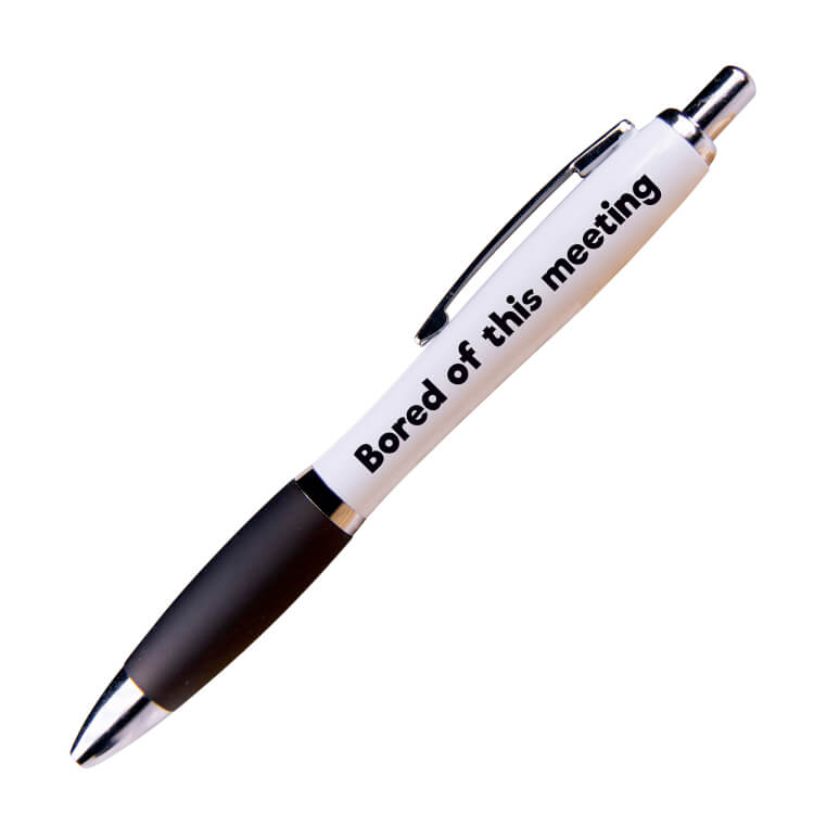 A white ballpoint pen with a black grip and black ink. Black text on one side reads Bored of this meeting
