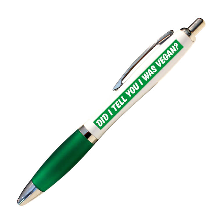 A white ballpoint pen with a green grip and black ink