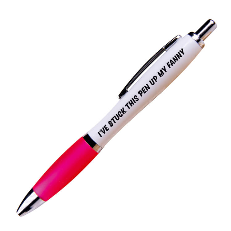 A white ballpoint pen with a pink grip and black ink. Black text on one side reads I've stuck this pen up my fanny