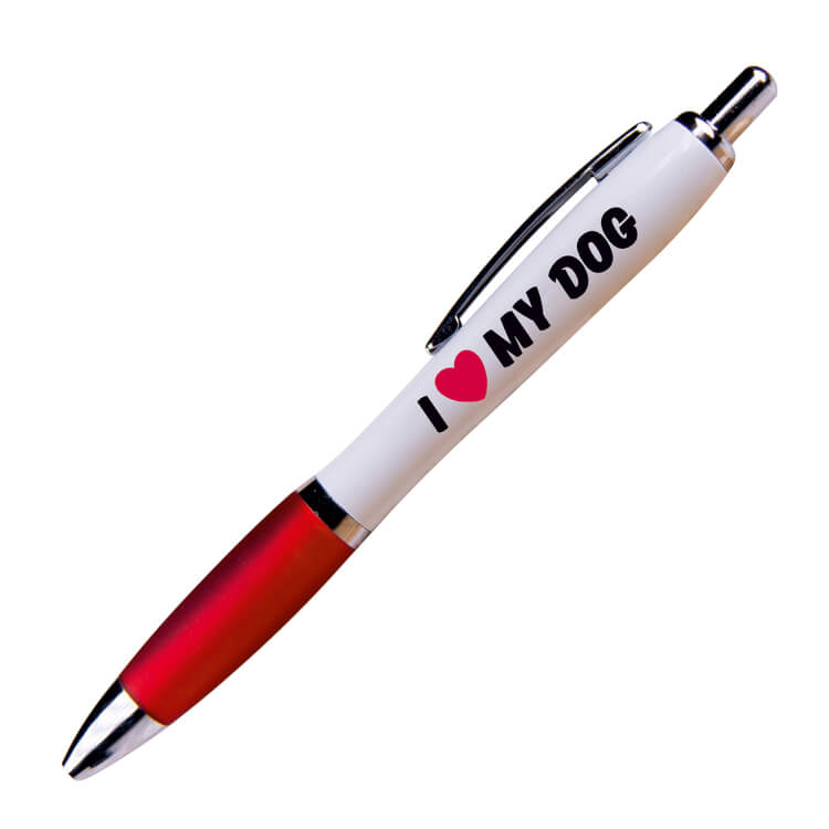A white ballpoint pen with a red grip and black ink. Bold black text on one side reads I love (heart symbol) my dog