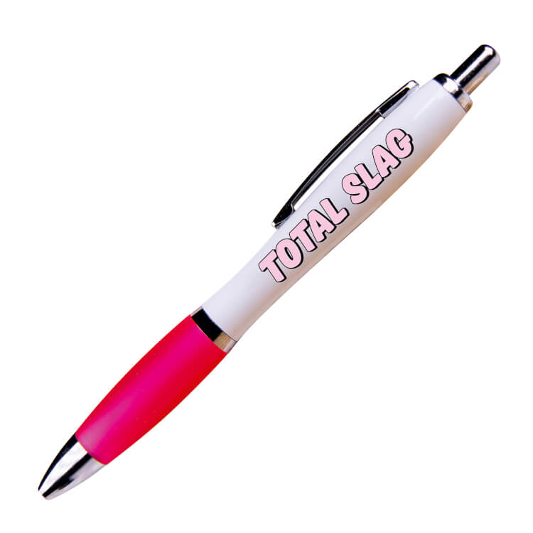 A white ballpoint pen with a pink grip and black ink. Slanted pink bold text with a black outline reads total slag