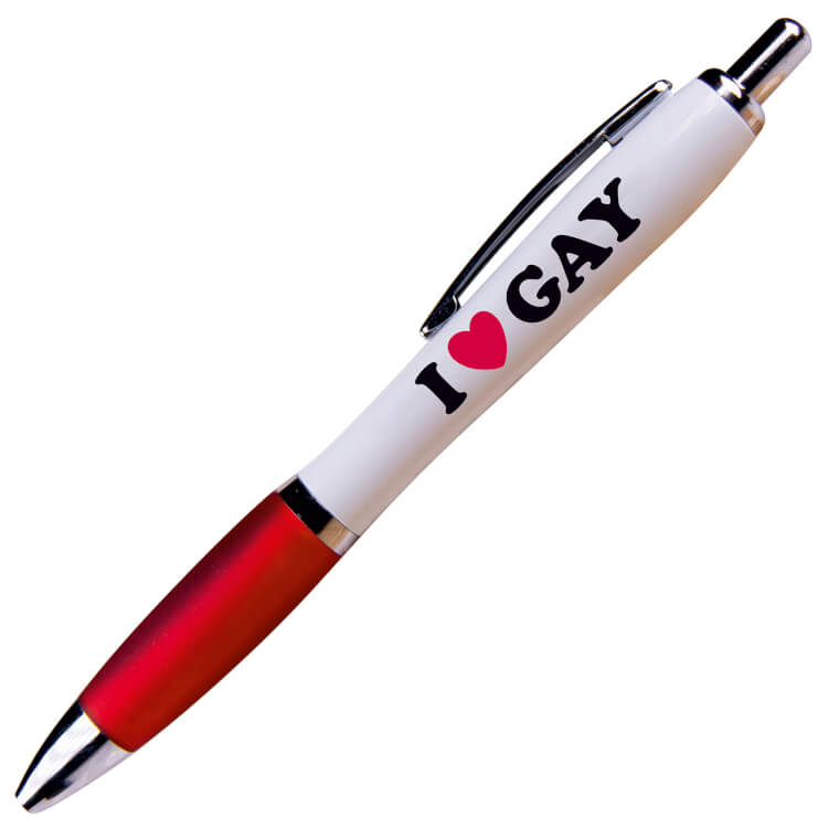 A white ballpoint pen with a red grip and black ink. Black and red text reads I love (heart) gay