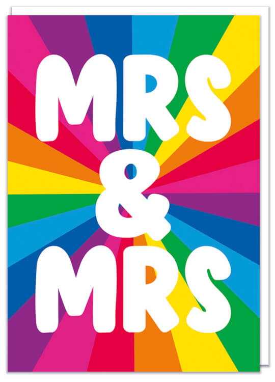 A greeting card, perfect for weddings featuring a rainbow stardust and in front bold white text that reads Mrs & Mrs